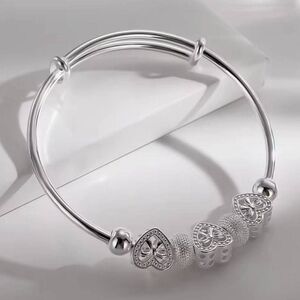 Sterling Silver Bangle Bracelet With Heart Shape Spacers